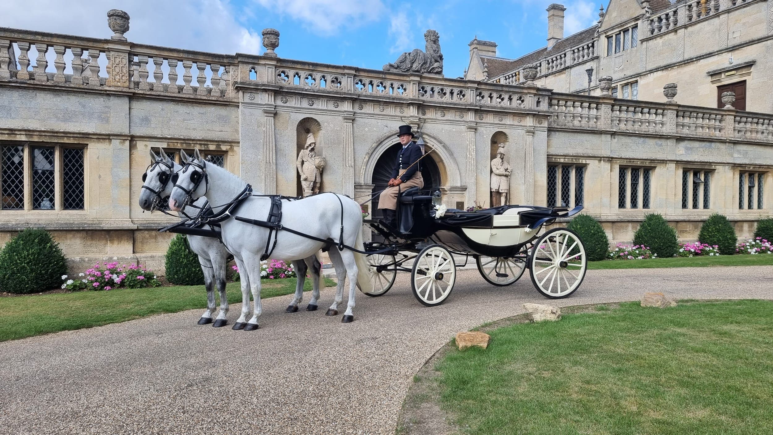 Grey Lippizaner horses with ivory Landau carriage at a Lincolnshire stately home wedding