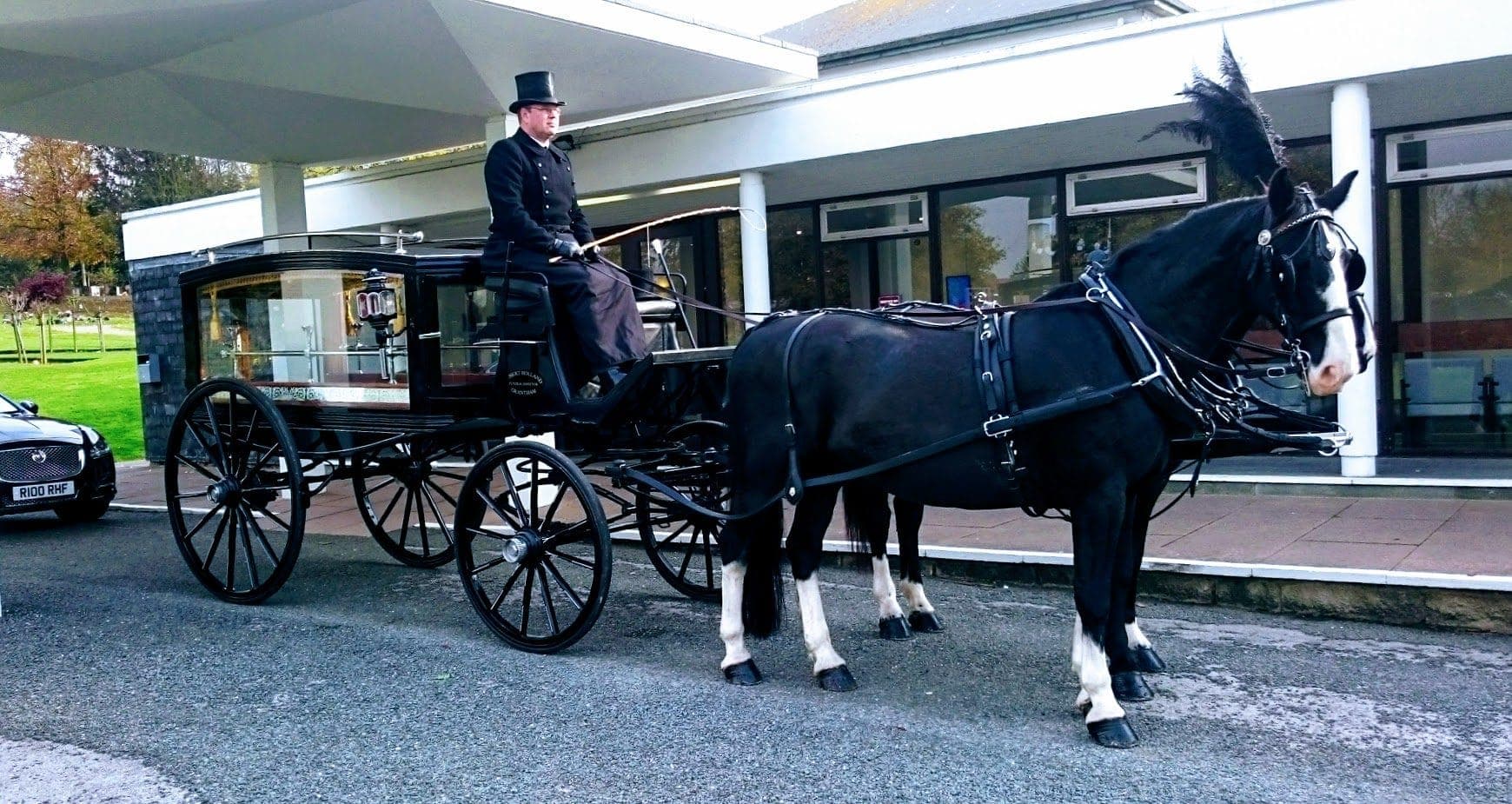 The blue DK Carriage Horses Landau drawn through the Lincolnshire countryside